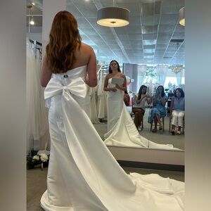 Never used Oxford street wedding dress. Not altered. Cathedral length.